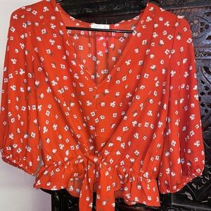 Red Blouse with White Floral design